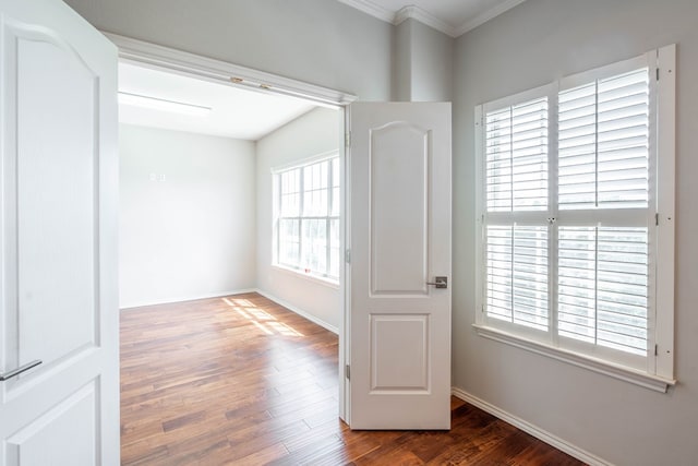 209 Bayberry Pkwy, Midland, TX 79705 - unfurnished room featuring wood finished floors, crown molding, and baseboards