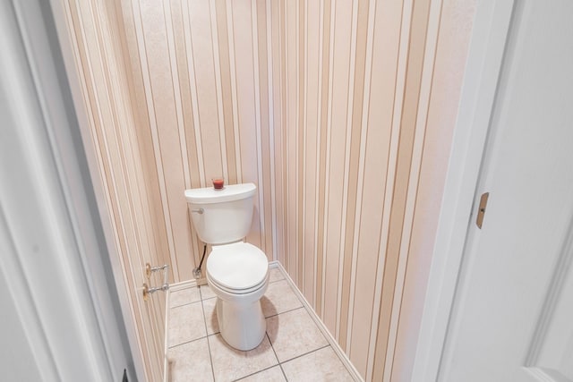 209 Bayberry Pkwy, Midland, TX 79705 - bathroom featuring tile patterned floors, toilet, and wood walls
