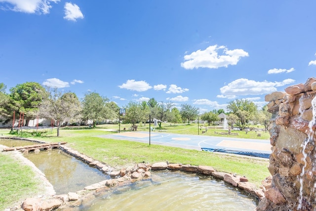 209 Bayberry Pkwy, Midland, TX 79705 - view of grassy yard with community basketball court