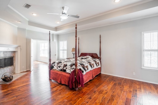 209 Bayberry Pkwy, Midland, TX 79705 - bedroom featuring ornamental molding, hardwood / wood-style floors, a raised ceiling, baseboards, and recessed lighting