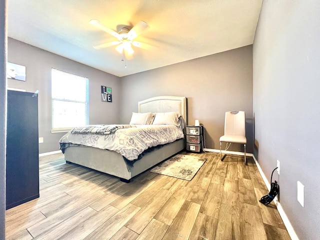 bedroom featuring ceiling fan and light wood-type flooring