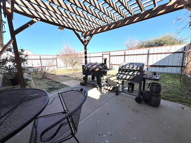 view of patio featuring a grill and a pergola