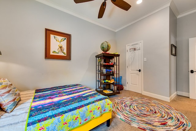 bedroom with carpet flooring, crown molding, baseboards, and a ceiling fan