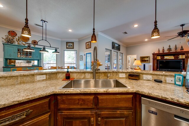 1102 Castle Rock Ct, Midland, TX 79705 - kitchen with stainless steel dishwasher, a sink, crown molding, ceiling fan, and recessed lighting