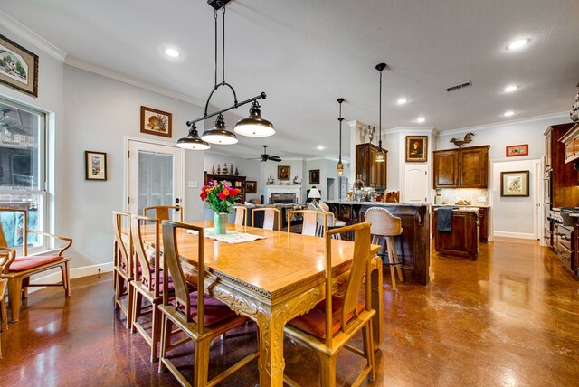 1102 Castle Rock Ct, Midland, TX 79705 - dining space featuring recessed lighting, crown molding, finished concrete flooring, a ceiling fan, and baseboards