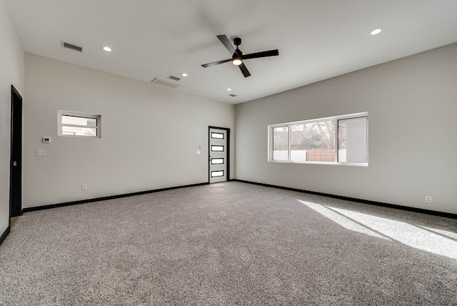 carpeted spare room featuring a ceiling fan, baseboards, visible vents, and recessed lighting