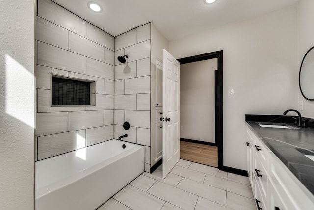 full bathroom featuring recessed lighting, shower / bathtub combination, double vanity, and a sink