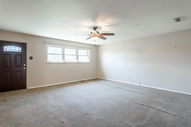 interior space with ceiling fan and carpet floors