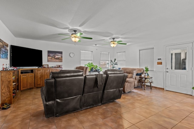 living room with light tile patterned floors and a textured ceiling