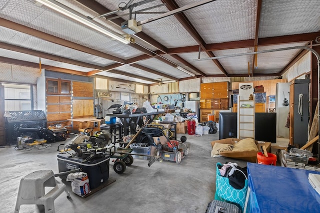 garage featuring a workshop area and a garage door opener