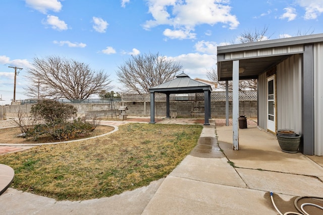 view of yard featuring a gazebo and a patio area