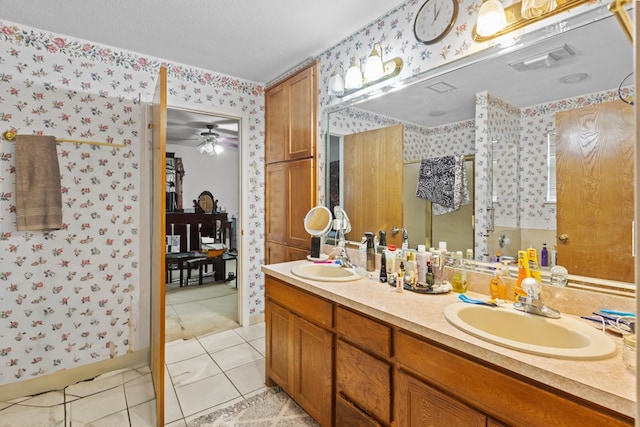 bathroom featuring vanity, tile patterned floors, and ceiling fan