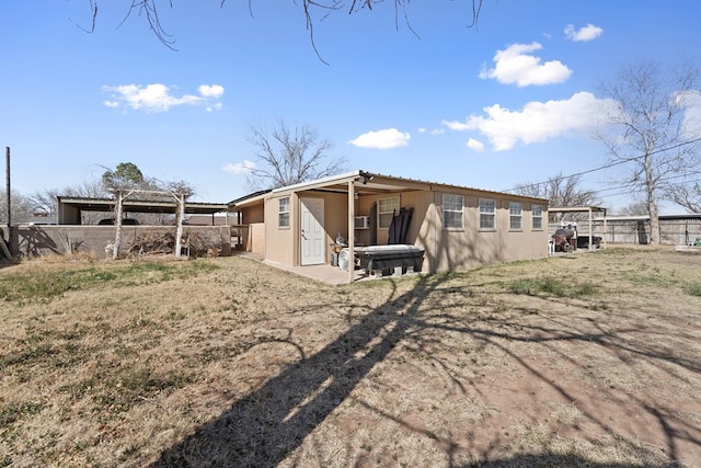 back of house with fence