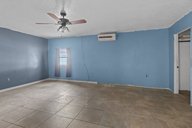 8528 W 24th St, Odessa, TX 79763 - empty room with a textured ceiling, ceiling fan, a wall mounted air conditioner, and tile patterned floors