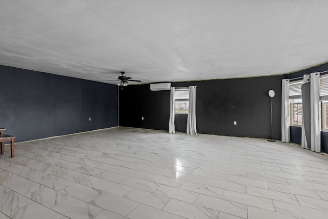 8528 W 24th St, Odessa, TX 79763 - spare room with ceiling fan, light marble finish flooring, and a wall mounted AC