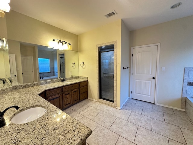 full bathroom featuring visible vents, tile patterned floors, a sink, a shower stall, and a bath