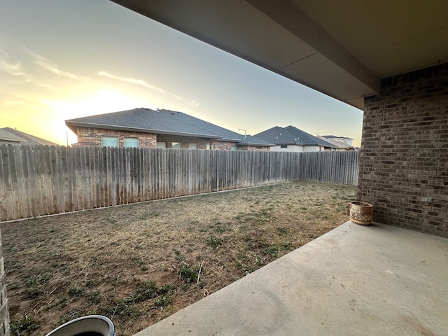 view of yard featuring a patio area and a fenced backyard