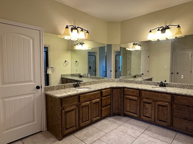 full bathroom with tile patterned flooring, a sink, and double vanity