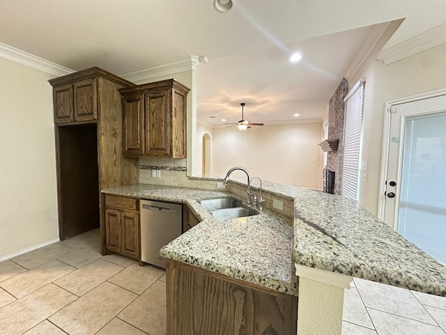 kitchen featuring crown molding, dishwasher, a peninsula, and a sink