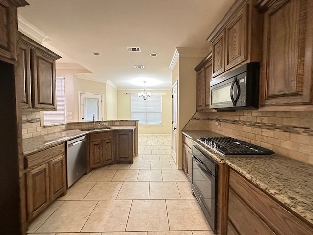 kitchen with light tile patterned floors, a notable chandelier, a sink, black appliances, and crown molding