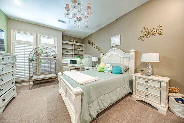 bedroom featuring light carpet, visible vents, and an inviting chandelier