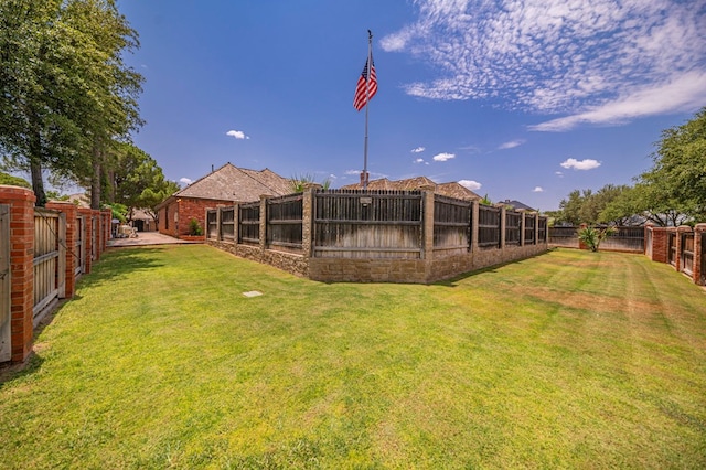 view of yard featuring a fenced backyard