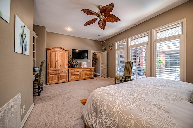 bedroom with light carpet, baseboards, visible vents, and ceiling fan