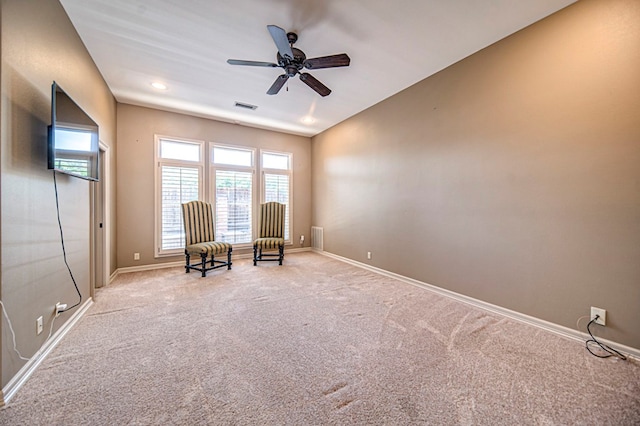 unfurnished room featuring ceiling fan, carpet floors, visible vents, and baseboards