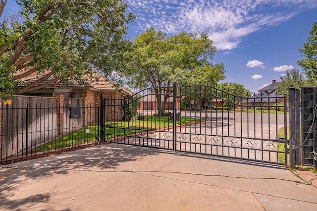 view of gate with fence