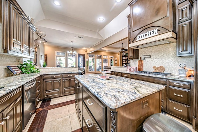 kitchen featuring recessed lighting, stainless steel appliances, a peninsula, backsplash, and a raised ceiling