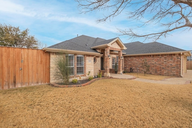 ranch-style house with a front yard