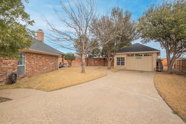 view of yard with a garage and an outdoor structure