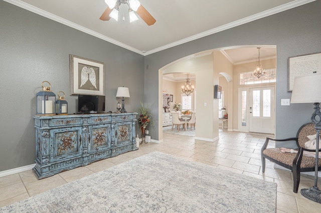 tiled living room with crown molding and ceiling fan with notable chandelier