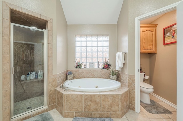 bathroom featuring tile patterned floors, toilet, and plus walk in shower