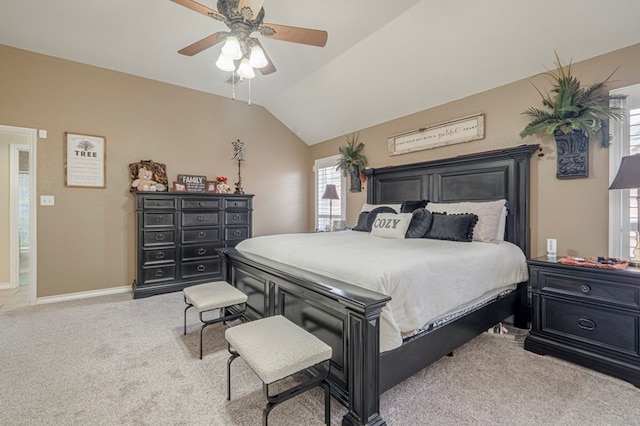 carpeted bedroom featuring lofted ceiling and ceiling fan