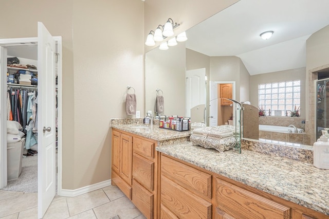 bathroom featuring vanity, tile patterned flooring, lofted ceiling, and plus walk in shower