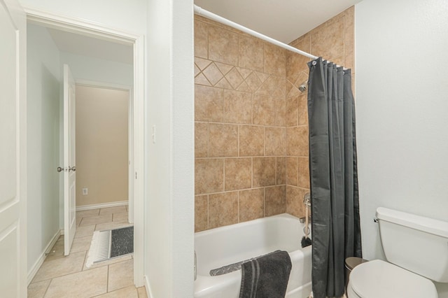 bathroom with tile patterned floors, shower / bath combination with curtain, and toilet