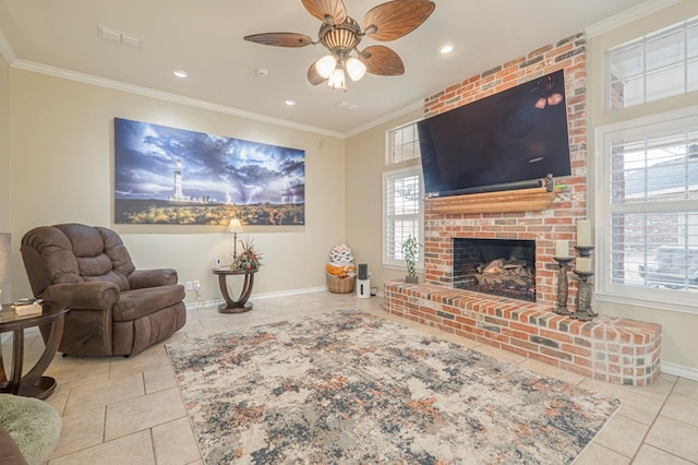 living room featuring crown molding, a fireplace, ceiling fan, and light tile patterned flooring