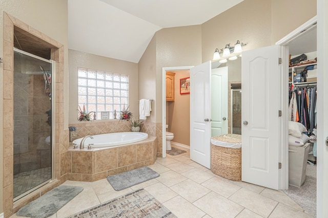 bathroom featuring toilet, tile patterned floors, lofted ceiling, and plus walk in shower