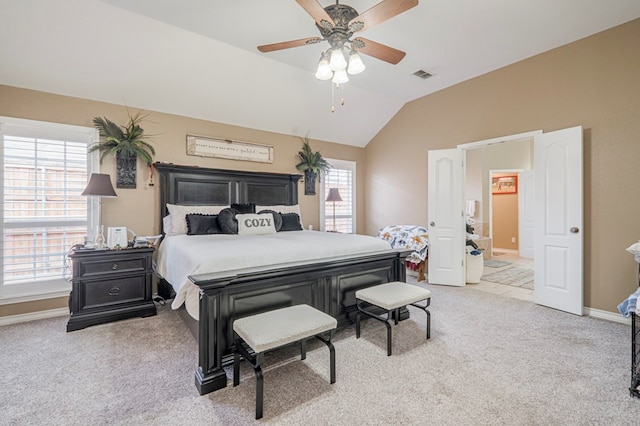 bedroom with lofted ceiling, light colored carpet, and ceiling fan