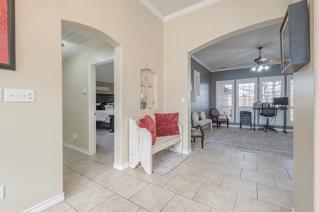 corridor featuring light tile patterned floors and ornamental molding