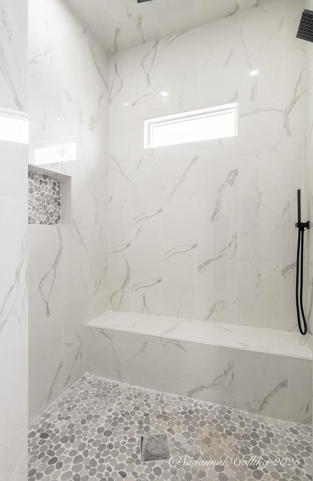 bathroom featuring tiled shower