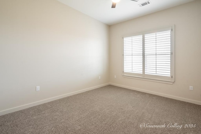 spare room featuring ceiling fan and carpet flooring