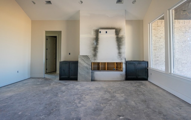 empty room with concrete flooring