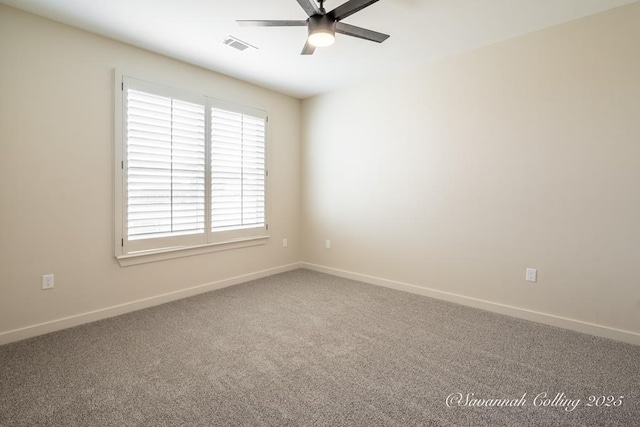 carpeted spare room with ceiling fan