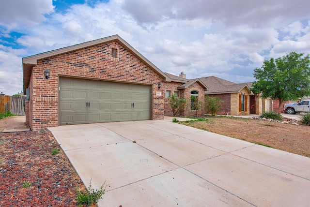 418 Orourke, Midland, TX 79706 - ranch-style house with brick siding, a garage, concrete driveway, and a chimney
