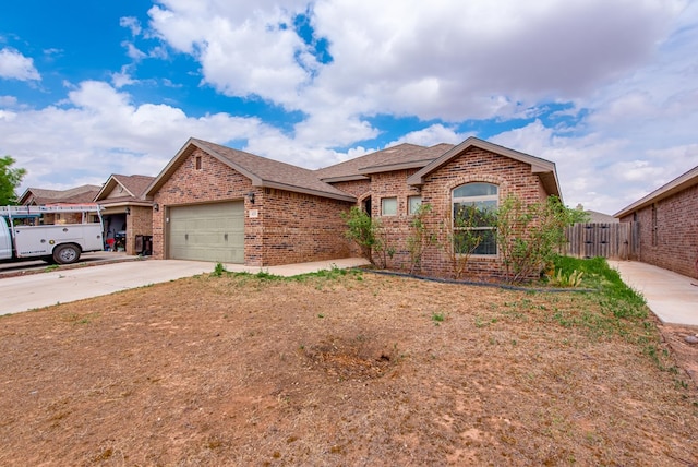 418 Orourke, Midland, TX 79706 - single story home featuring brick siding, an attached garage, a shingled roof, and driveway