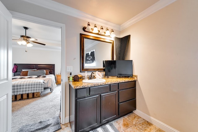 418 Orourke, Midland, TX 79706 - ensuite bathroom with vanity, ornamental molding, baseboards, and a ceiling fan