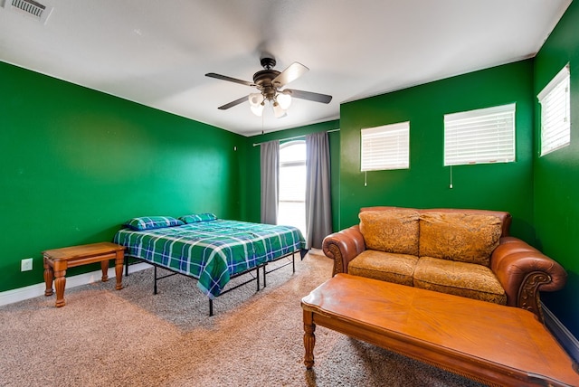 418 Orourke, Midland, TX 79706 - bedroom featuring multiple windows, carpet flooring, ceiling fan, and baseboards