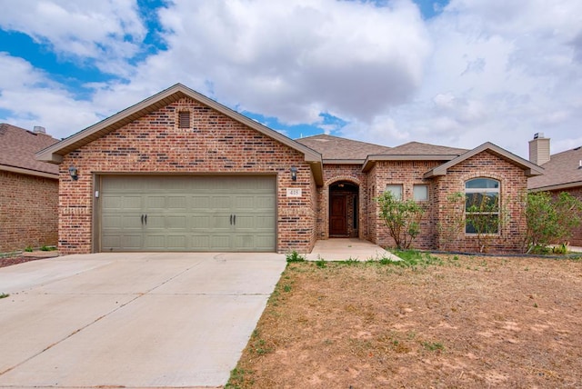 418 Orourke, Midland, TX 79706 - view of front of home with brick siding, concrete driveway, a garage, and a shingled roof